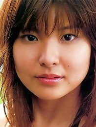 Hanai Miri posing in dark bikini her huge breasts