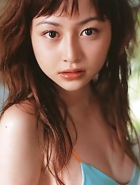 Sizzling hot gravure idol babe with soft plump boobs in a bikini